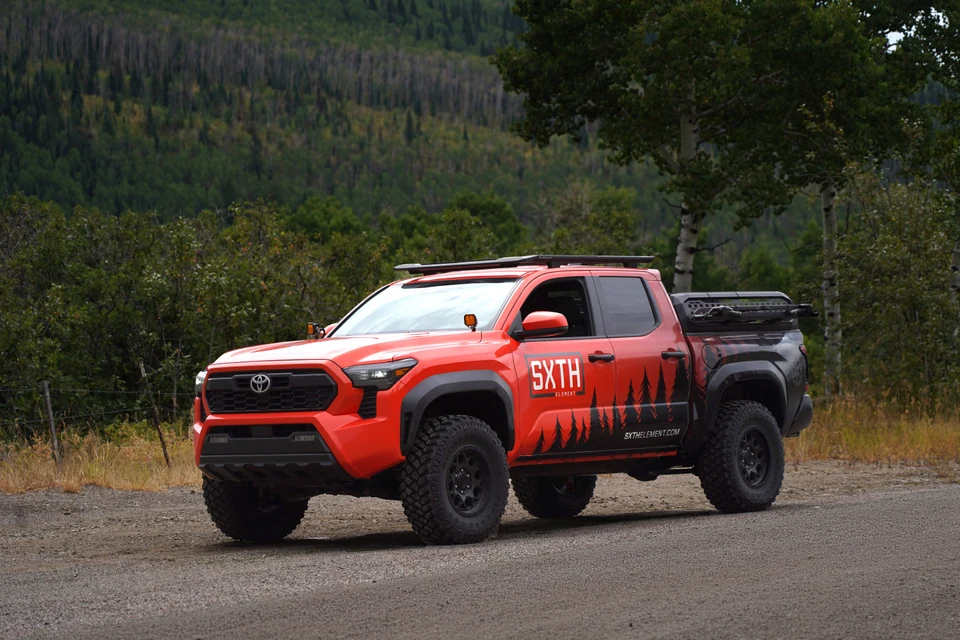 SXTH Toyota Tacoma on a wooded trail